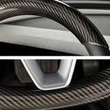 Close-up view of real carbon fiber texture steering wheel overlay for Tesla Model Y Juniper