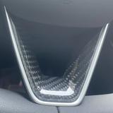 Glossy finish carbon fiber texture on Model Y Juniper steering wheel trim