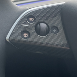 Glossy finish carbon fiber texture on Model Y Juniper steering wheel trim