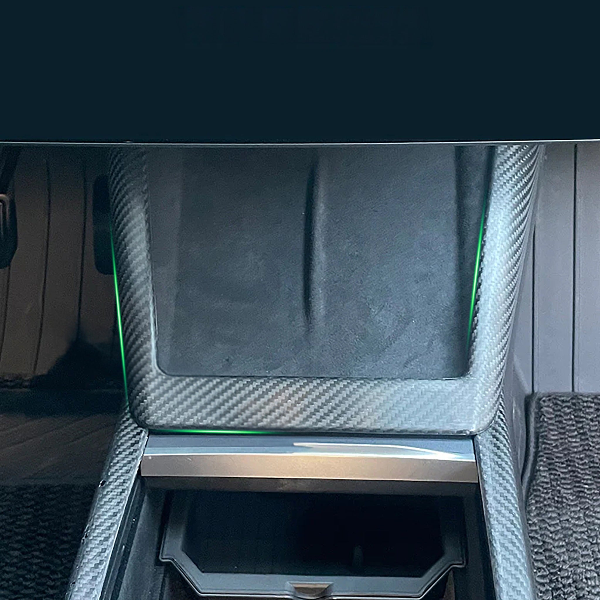Tesla Model Y Juniper with Carbon Fiber Charging Pad Frame installed