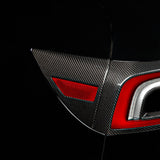 Tesla with installed Carbon Fiber charging port panel & Tail Light accent