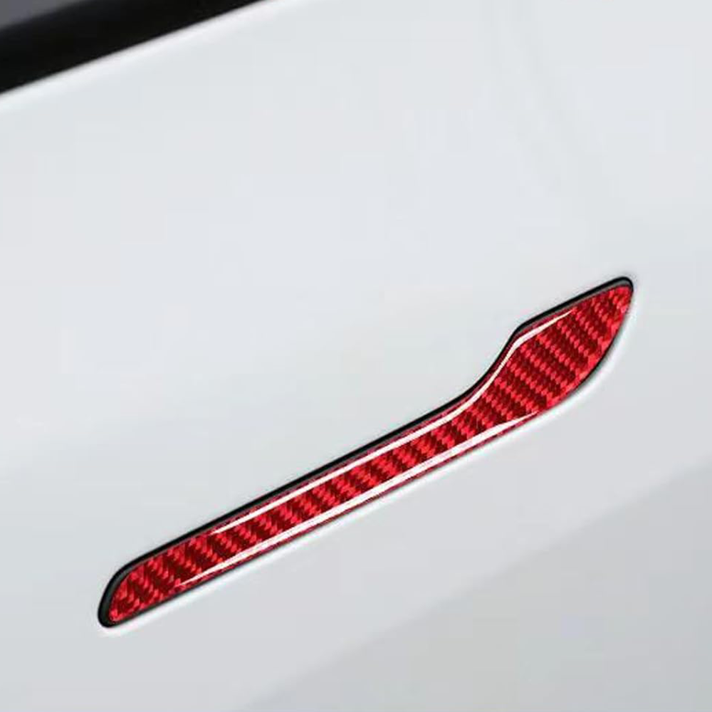 White Tesla Model Y with red carbon fiber door handle cover installed