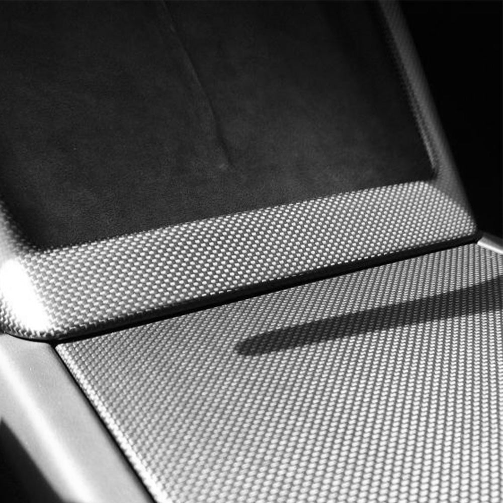 Close-up of Plian weave Carbon Fiber Wireless Charging Pad Frame Overlay installed on Tesla Model 3 Highland