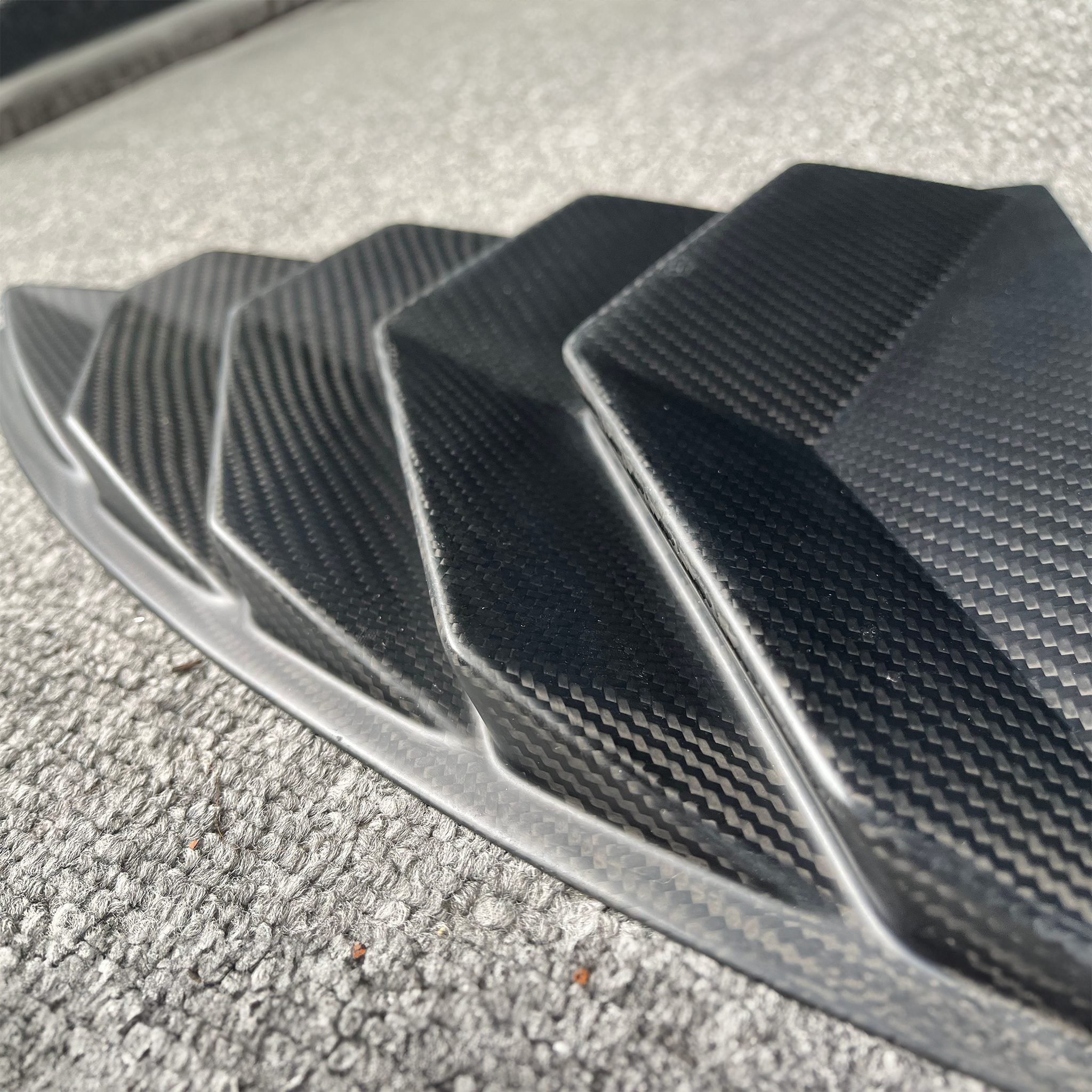 Close up view of Tesla Model Y Carbon Fiber Rear Side Window Louvers