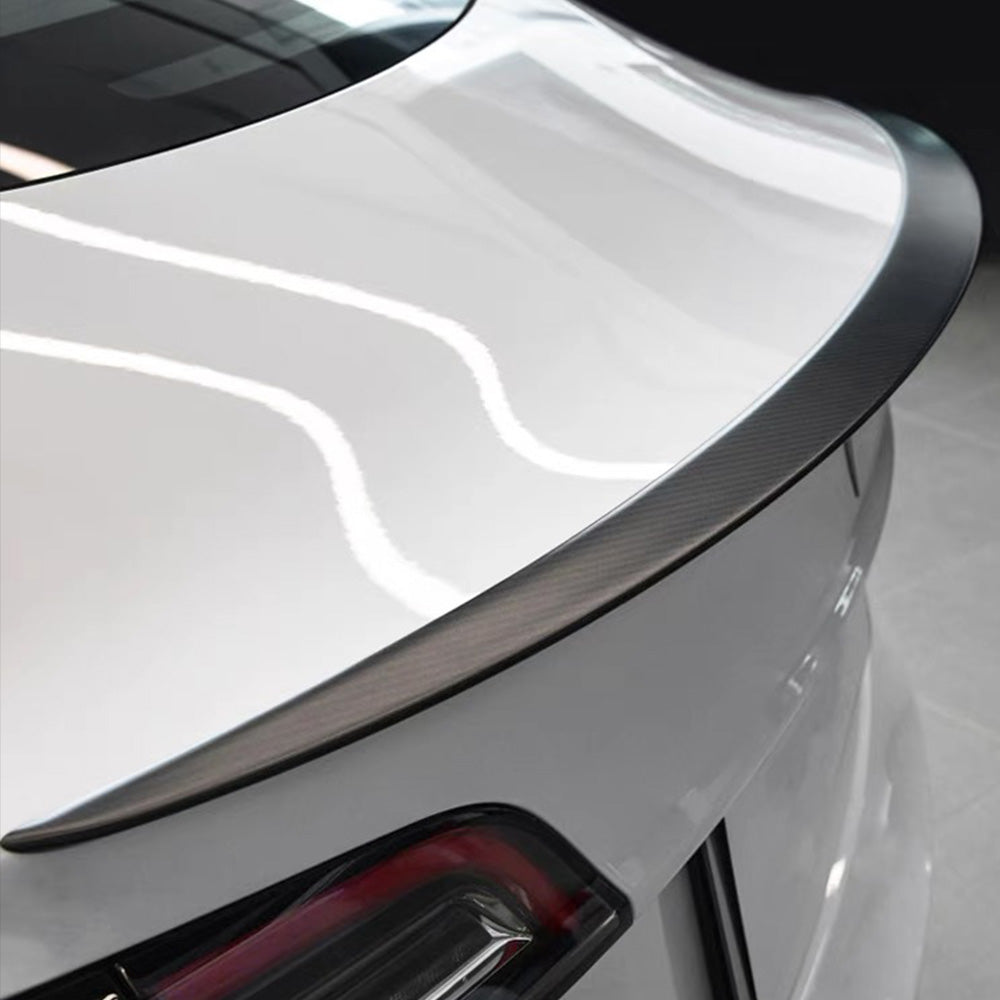 High-Performance Carbon Fiber Spoiler installed on a wihte Tesla Model 3/Y