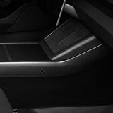 Close-up view of real carbon fiber texture on Tesla Model 3 Highland console side panel cover