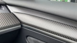 Close up of Real Carbon Fiber Front Door Trim Cover and dashboard cover installed on Tesla model 3/Y