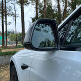 Rear view of a Real Carbon Fiber Mirror Covers installed on a 2024+ Tesla Model 3 Highland