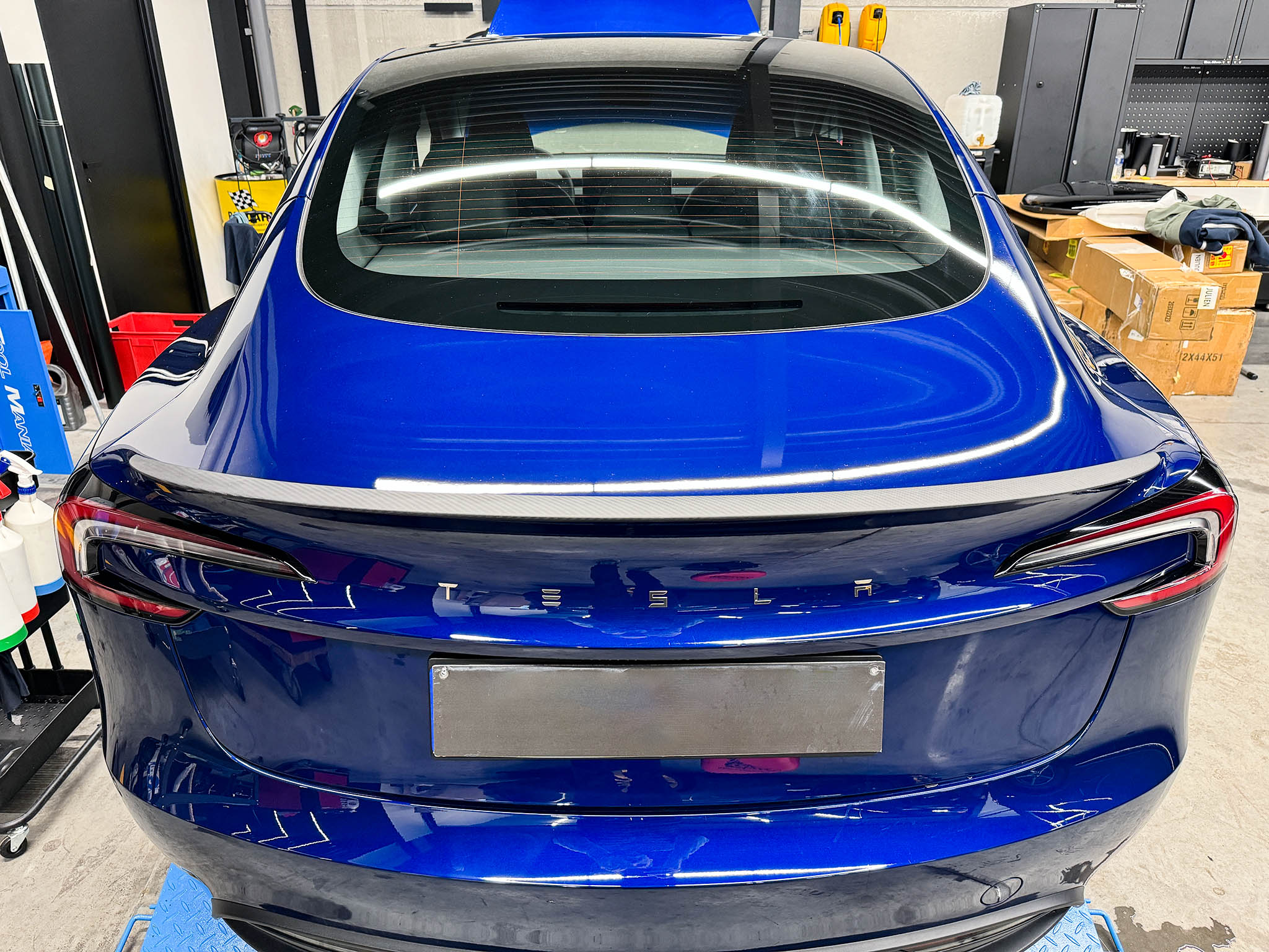Front view of Carbon Fiber Spoiler (Older Performance Style) installed on Tesla Model 3 Highland