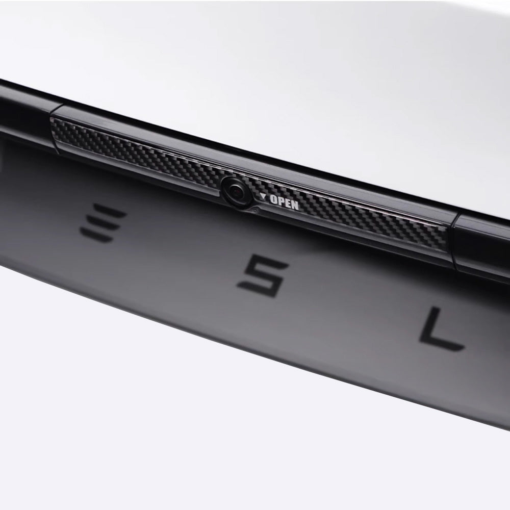 Black real carbon fiber texture on Tesla Model Y Juniper Trunk Button Accent Sticker