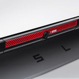 close up of real carbon fiber texture on Tesla Model Y Juniper Trunk Button Accent Sticker