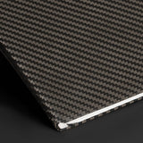 Detail view of Carbon Fiber texture on Tesla Model Y/3 Glove Box Cover