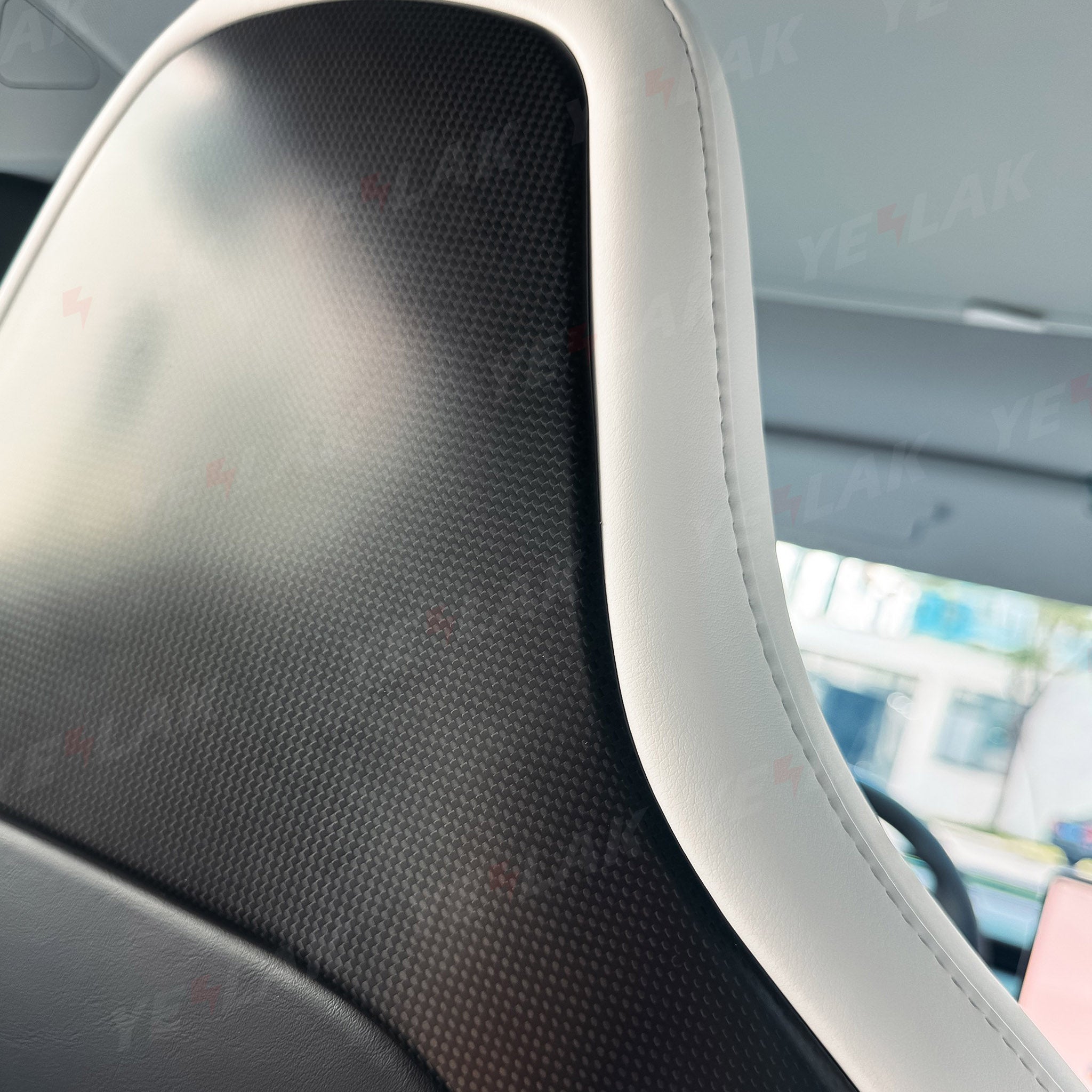 Close-up of Carbon Fiber Seat Back Covers for Tesla Model 3 Highland Performance - Plain weave