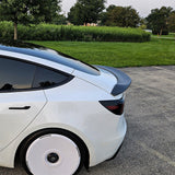 Side view of Real Carbon Fiber V-Style Spoiler installed on Tesla Model 3 Highland (2024+)