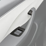 Front view of Real Carbon Fiber Window Switch Trim Covers installed on Tesla Model Y/3