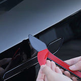 Peel off the adhesive backing from the Tesla door handle attachment.