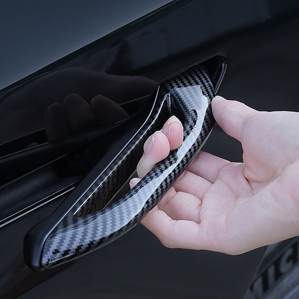 A view showing the door handle add-on installed on a Tesla Model Y.