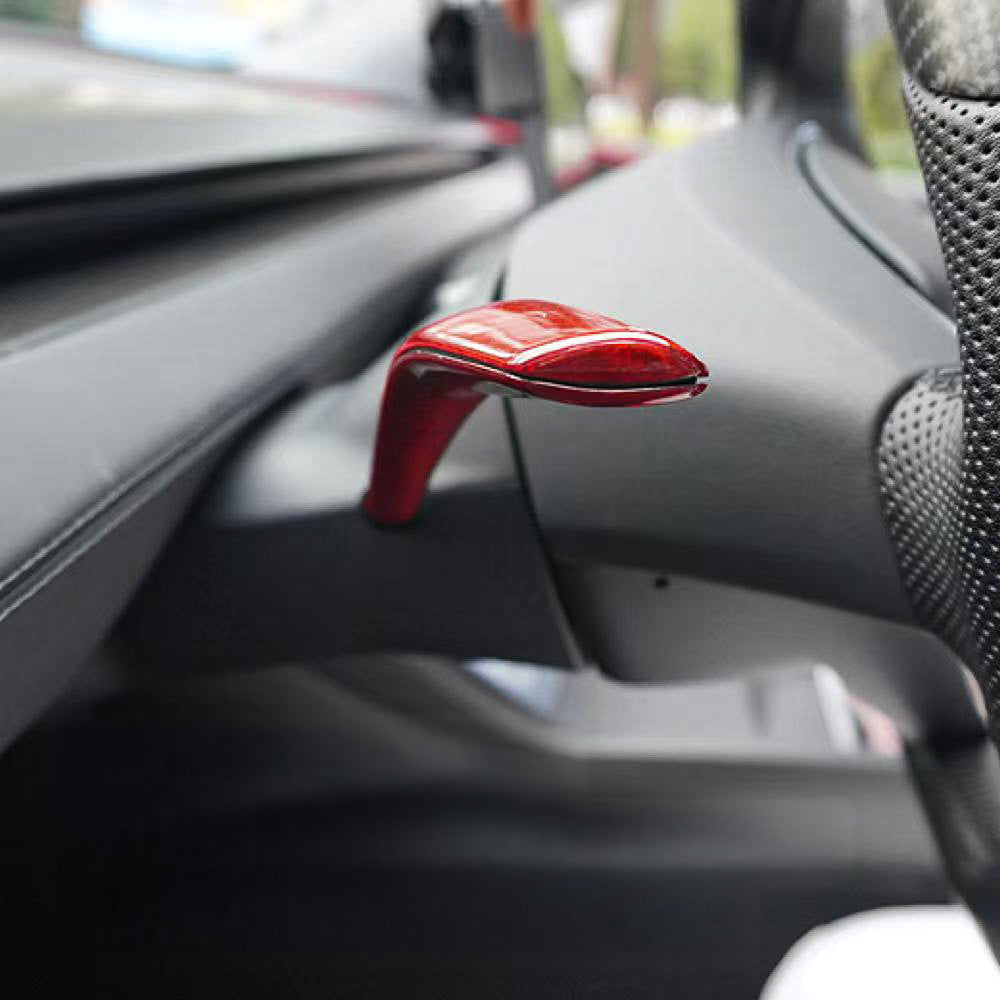 Side view of Red glossy Carbon Fiber Turn Signal Stalk Covers installed on Tesla Model Y Juniper