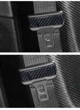 close up detail of Tesla Model 3/Y glossy Carbon Fiber Seat Belt Covers