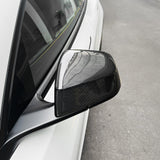 close-up detail shot of Tesla model Y Juniper with Carbon Fiber Mirror Caps installed - glossy finish