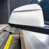 front view of Carbon Fiber Mirror Lower Cover installed on Tesla Model Y – glossy finish