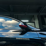 Side view of Tesla Model Y with carbon fiber mirror cover installed