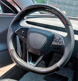 Model 3 Highland with carbon fiber Steering Wheel Overlay installed