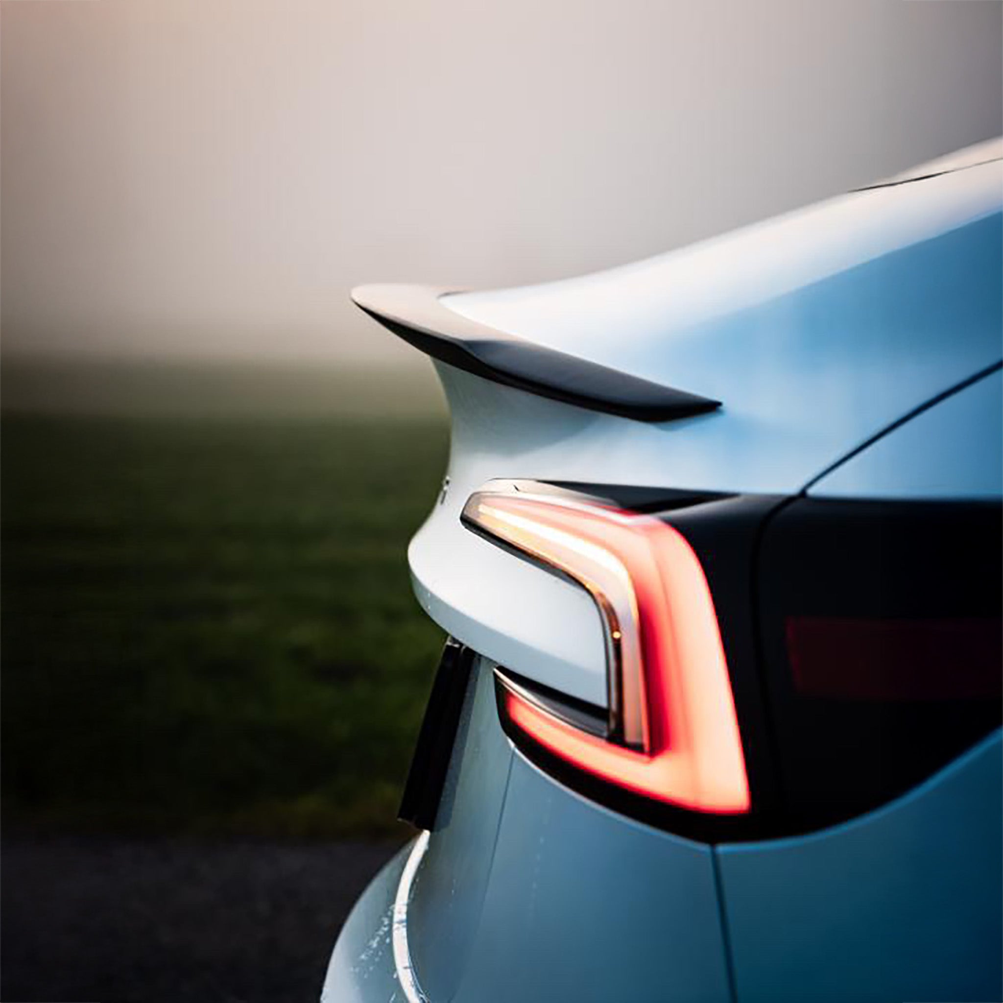 Side view of Carbon Fiber Spoiler installed on Tesla Model 3 Highland