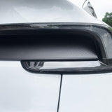 Detailed shot of matte carbon fiber finish on Tesla Model Y Juniper taillight overlay