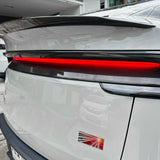 Tesla Model Y Juniper with carbon fiber lower taillight overlay installed