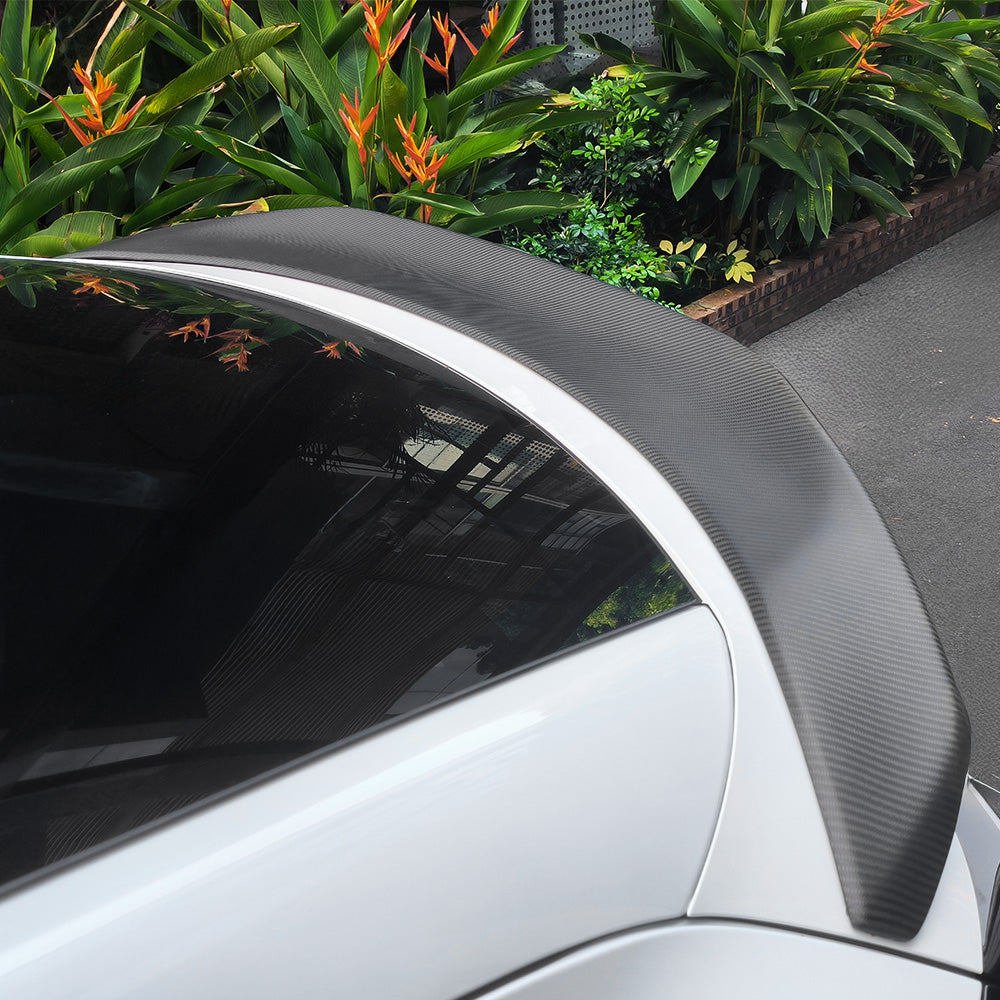 Side view of Model Y Juniper V-Style Carbon Fiber Rear Spoiler installed