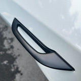 A view showing the door handle add-on installed on a white Tesla Model Y.