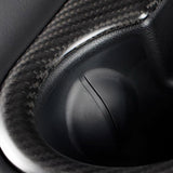 close up of Tesla Model Y Juniper Real Carbon Fiber Rear Cup Holder Cover