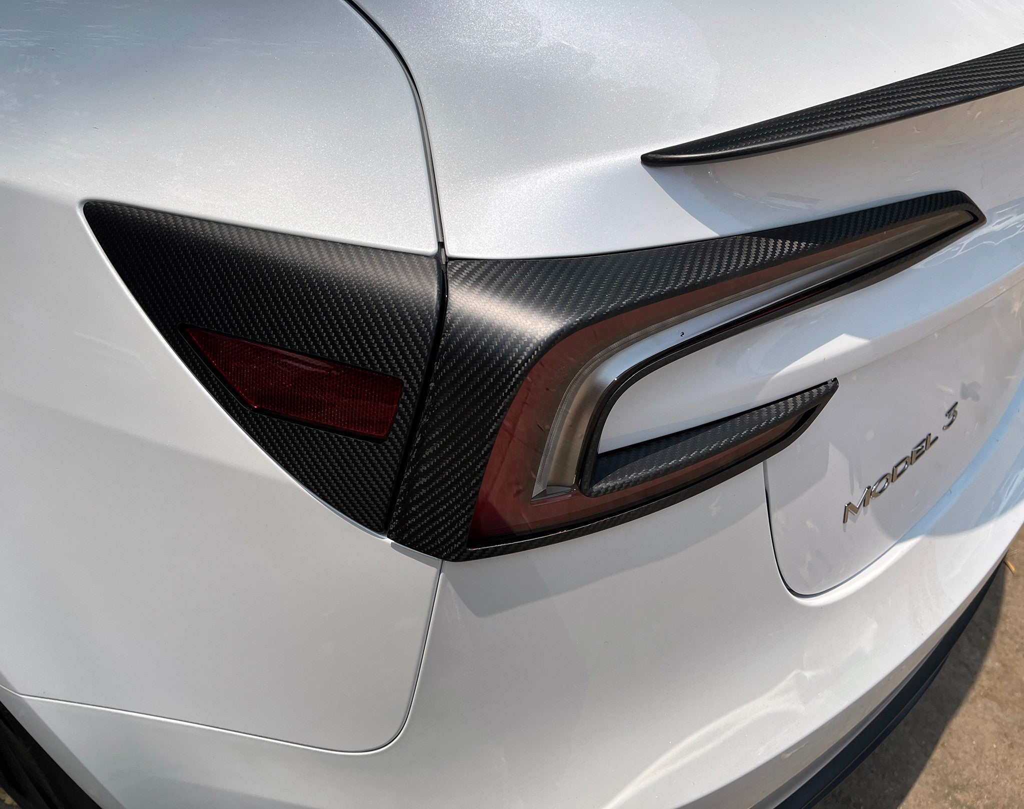 Tesla model 3 Carbon Fiber Charging Port Covers live shot