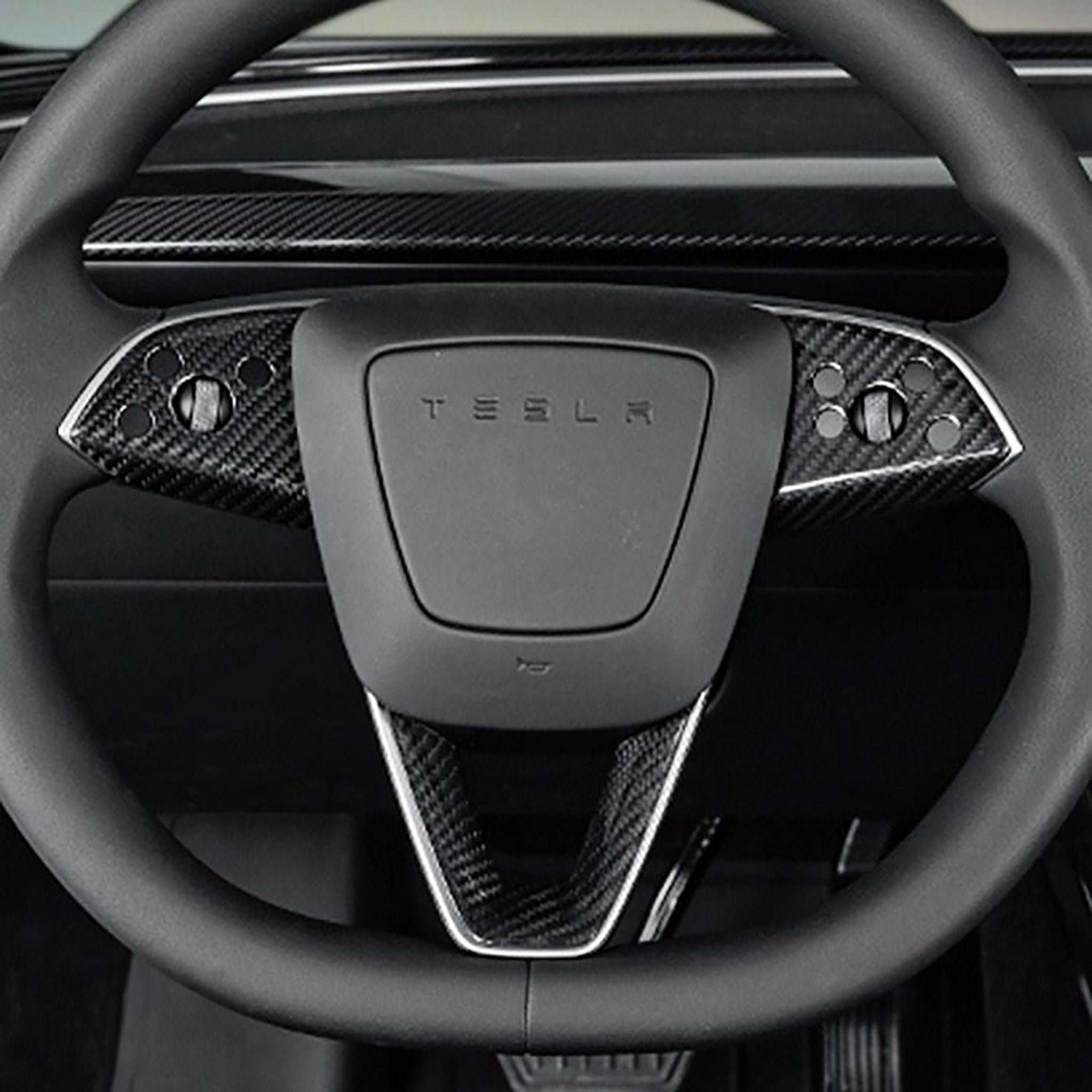 View of Carbon Fiber Steering Wheel Trim installed on Tesla Model 3 Highland