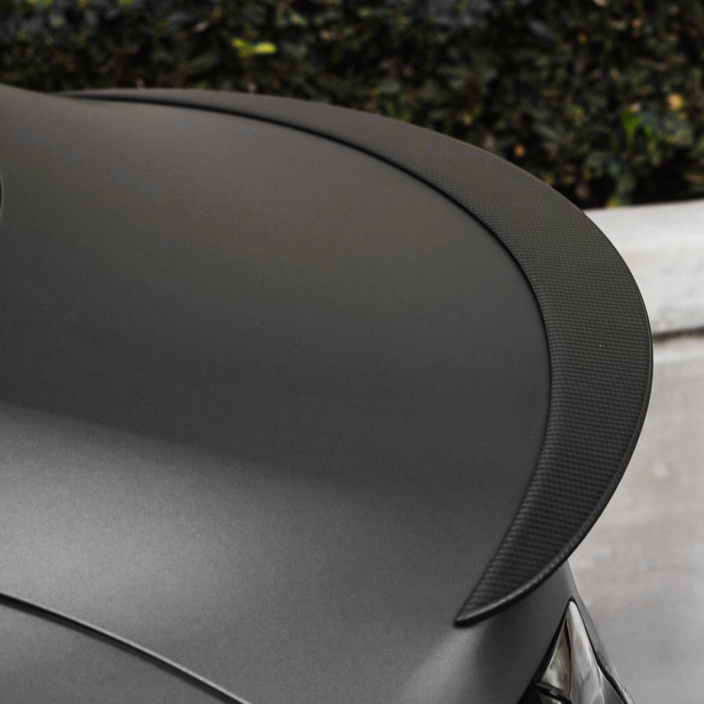 High-Performance Carbon Fiber Spoiler installed on black Tesla Model 3/Y