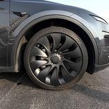Performance Uberturbine Style Wheel Covers installed on Tesla Model Y Juniper 20" Helix 2.0 Wheels