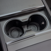 Real carbon fiber Cup Holder overlays installed on Tesla Model Y/3
