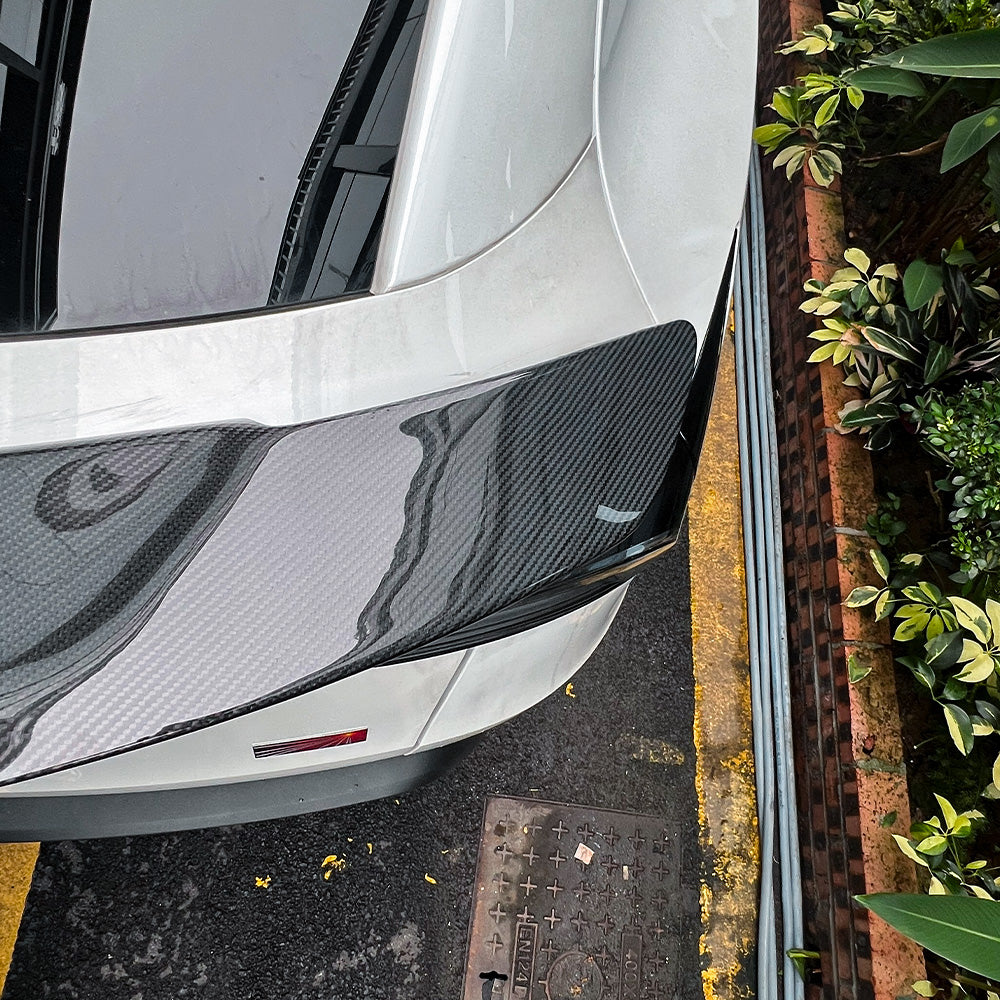 close-up detail shot of Model Y Juniper RT-style carbon fiber spoiler-glossy