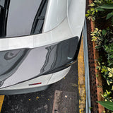 close-up detail shot of Model Y Juniper RT-style carbon fiber spoiler-glossy