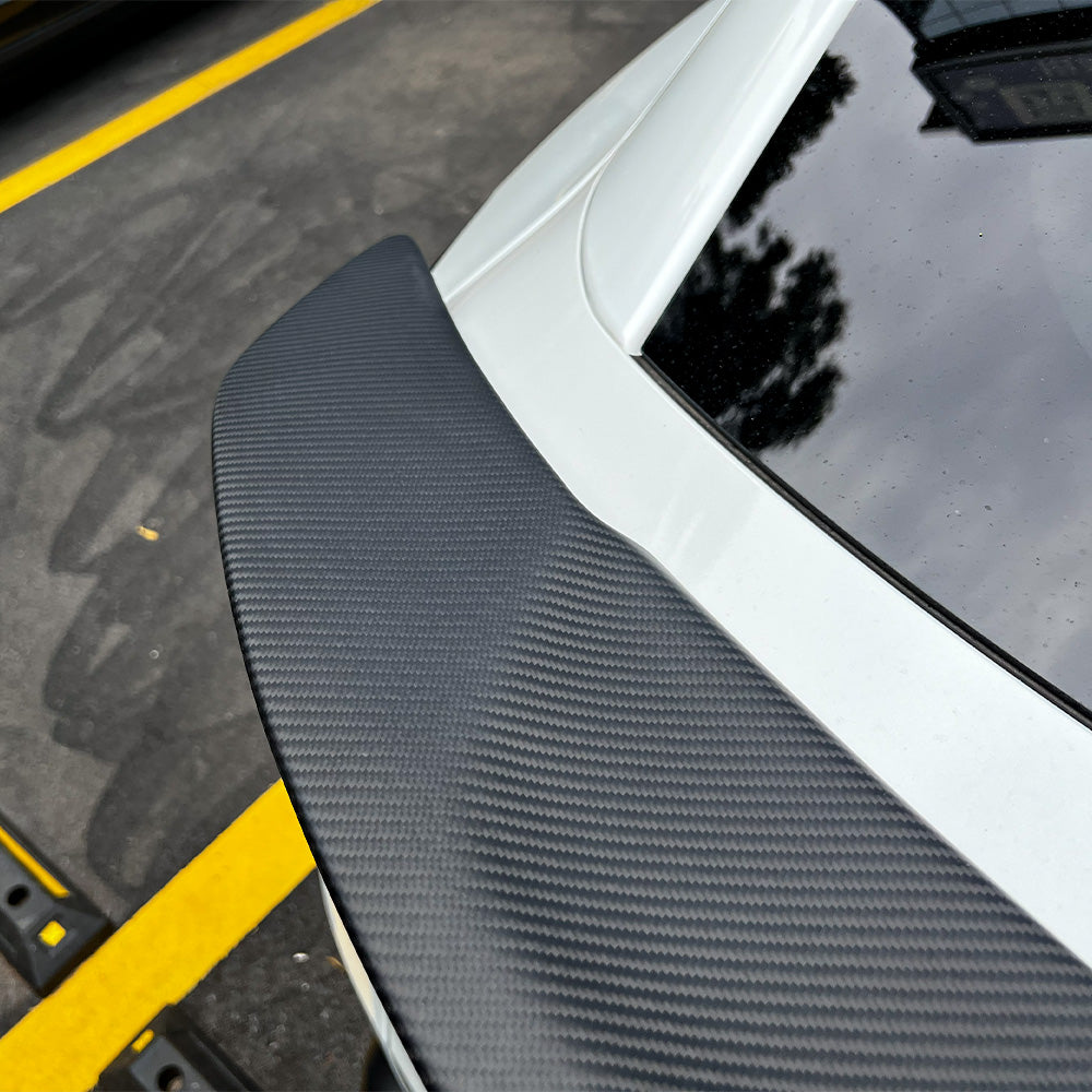close-up detail shot of RT-Style Carbon Fiber Spoiler Wing for Model Y Juniper-matte