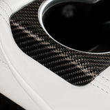 Close-up of Carbon Fiber rear Cup Holder Cover installed on Tesla Model 3 Highland