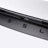 Black real carbon fiber texture on Tesla Model Y Juniper Trunk Button Accent Sticker