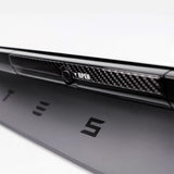 close up of black real carbon fiber texture on Tesla Model Y Juniper Trunk Button Accent Sticker