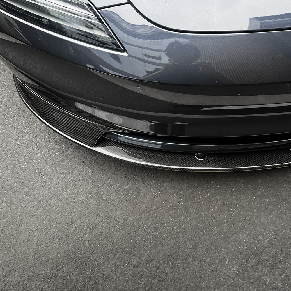 Close-up of Real Carbon Fiber Aero Front Lip Spoiler installed on 2024+ Tesla Model 3 Premium