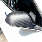 Matte Dry Carbon Fiber Mirror Cap installed on Tesla Model 3/Y