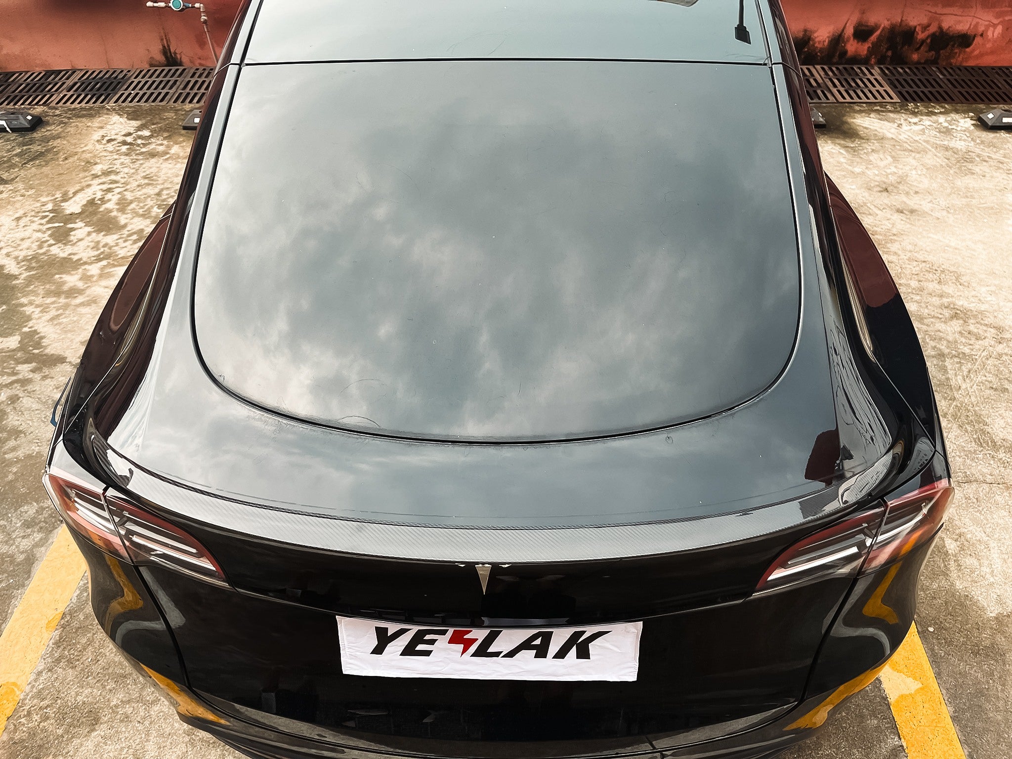 Top view of Teego High-Performance Glossy Carbon Fiber Spoiler installed on Tesla Model Y