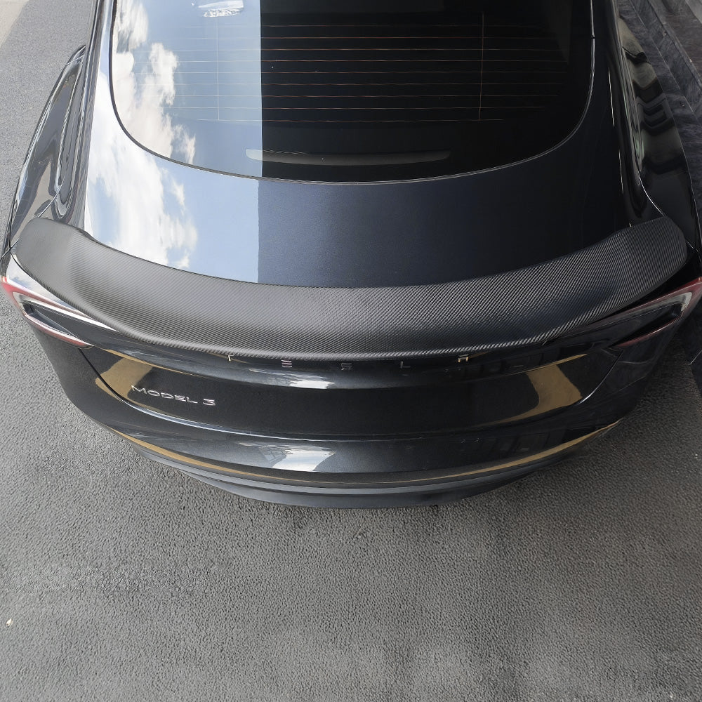 Top view of Real Carbon Fiber V-Style Spoiler installed on Tesla Model 3 Highland (2024+)