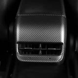 Front view of Carbon Fiber Rear AC Outlet Cover installed on Tesla Model 3