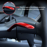 Red glossy Carbon Fiber Turn Signal Stalk Covers installed on Tesla Model Y Juniper